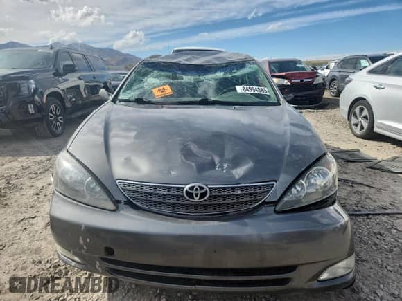 2005 Toyota Camry LE z VIN 4T1BE30K65U519532, wystawiony jako Copart lot #84994885 z przebiegiem Nie podano mil oraz Szkoda całkowita • Salvage title. Historia ofert i sprzedaży dostępna na DreamBid. Obrazek 5.