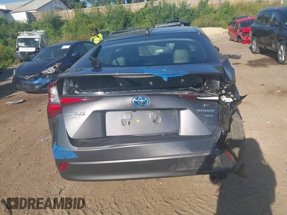 2021 Toyota Prius LE with VIN JTDL9MFU8M3028928, listed as a IAAI auction lot 43099318 with 72,833 mi miles and . Bid and sale history available at DreamBid. Image 6.