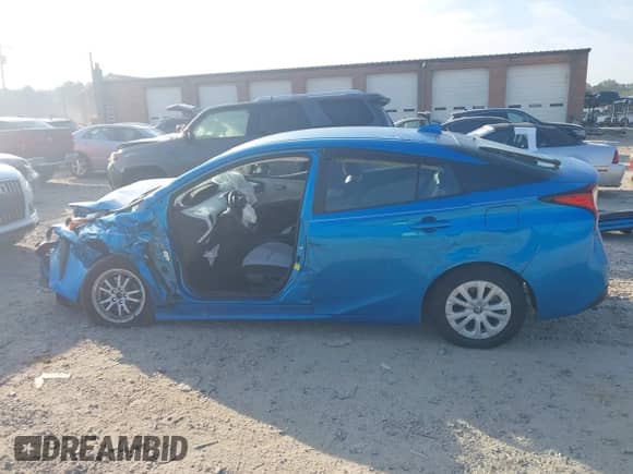 2021 Toyota Prius L Eco with VIN JTDKAMFU1M3136133, listed as a IAAI auction lot 43285926 with 49,911 mi miles and . Bid and sale history available at DreamBid. Image 13.