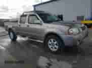 2003 Nissan Frontier XE with VIN 1N6ED29X33C464373, listed as a Copart auction lot 70272955 with 249,282 mi miles and Salvage title. Bid and sale history available at DreamBid. Image 4.