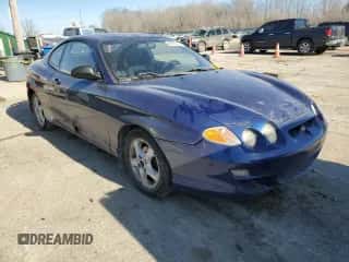 2001 Hyundai Tiburon с VIN KMHJG25F11U261457, выставлен на аукционе Copart как лот 43012635 с пробегом 165 625 миль миль и Списание • Salvage title. История ставок и продаж доступна на DreamBid. Изображение 4.