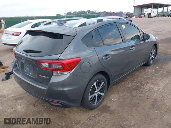 2021 Subaru Impreza Premium with VIN 4S3GTAD67M3711211, listed as a IAAI auction lot 42943255 with 97,769 mi miles and . Bid and sale history available at DreamBid. Image 4.