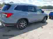 2022 Honda Pilot Touring 7-Passenger z VIN 5FNYF5H6XNB019297, wystawiony jako IAAI lot #43086671 z przebiegiem 29 833 mil mil oraz . Historia ofert i sprzedaży dostępna na DreamBid. Obrazek 4.