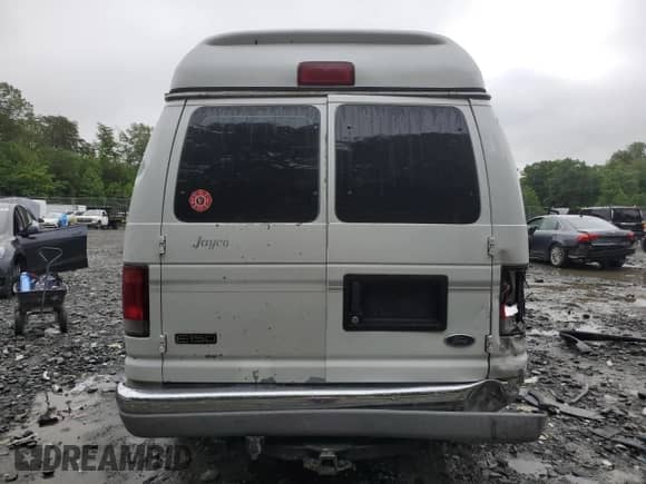 2000 Ford Econoline Cargo Recreational with VIN 1FDRE14L3YHA17676, listed as a Copart auction lot 58571465 with 174,129 mi miles and Salvage title. Bid and sale history available at DreamBid. Image 6.