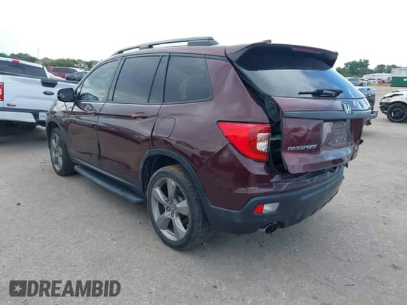 2019 Honda Passport Touring with VIN 5FNYF7H95KB004417, listed as a IAAI auction lot 42551496 with 62,948 mi miles and . Bid and sale history available at DreamBid. Image 3.