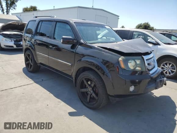 2011 Honda Pilot Touring with VIN 5FNYF3H9XBB041665, listed as a Copart auction lot 70728095 with 198,665 mi miles and Salvage title. Bid and sale history available at DreamBid. Image 4.