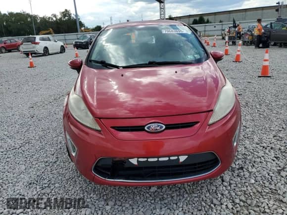 2011 Ford Fiesta SES z VIN 3FADP4FJ7BM104334, wystawiony jako Copart lot #70683695 z przebiegiem 96 056 mil mil oraz Szkoda całkowita • Salvage title. Historia ofert i sprzedaży dostępna na DreamBid. Obrazek 5.