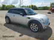 2007 MINI Hardtop with VIN WMWMF33597TT56851, listed as a Copart auction lot 68785325 with 140,683 mi miles and Salvage title. Bid and sale history available at DreamBid. Image 4.