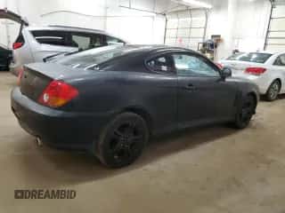2003 Hyundai Tiburon с VIN KMHHM65D03U037970, выставлен на аукционе Copart как лот 51482024 с пробегом 178 210 миль миль и На запчасти • Non repairable. История ставок и продаж доступна на DreamBid. Изображение 3.