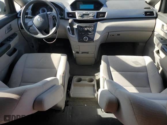 2012 Honda Odyssey LX with VIN 5FNRL5H27CB081019, listed as a Copart auction lot 84878565 with 110,802 mi miles and Salvage title. Bid and sale history available at DreamBid. Image 8.