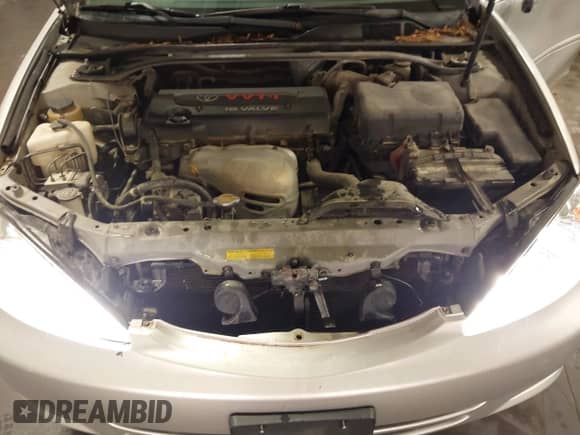 2002 Toyota Camry LE z VIN 4T1BE32K02U033310, wystawiony jako IAAI lot #42586585 z przebiegiem 154 658 mil mil oraz . Historia ofert i sprzedaży dostępna na DreamBid. Obrazek 10.