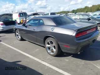 2013 Dodge Challenger SXT with VIN 2C3CDYAG0DH684162, listed as a IAAI auction lot 43399757 with 113,941 mi miles and . Bid and sale history available at DreamBid. Image 3.