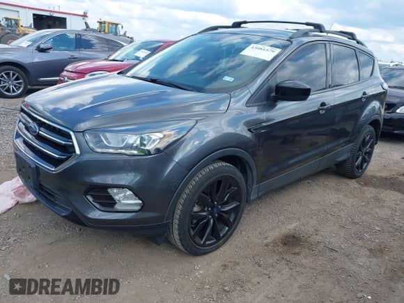 2018 Ford Escape SE z VIN 1FMCU9GD7JUC34463, wystawiony jako IAAI lot #43081579 z przebiegiem 85 940 mil mil oraz . Historia ofert i sprzedaży dostępna na DreamBid. Obrazek 17.