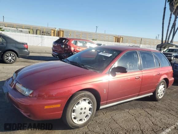 1997 Saturn SW with VIN 1G8ZK8272VZ371975, listed as a Copart auction lot 75880424 with 121,194 mi miles and Salvage title. Bid and sale history available at DreamBid. Image 1.