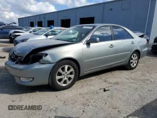 2005 Toyota Camry LE with VIN 4T1BF32KX5U596821, listed as a Copart auction lot 87047295 with 169,634 mi miles and Salvage title. Bid and sale history available at DreamBid. Image 1.