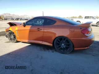 2006 Hyundai Tiburon GT с VIN KMHHN65FX6U207318, выставлен на аукционе Copart как лот 68147734 с пробегом 180 284 миль миль и Списание • Salvage title. История ставок и продаж доступна на DreamBid. Изображение 2.