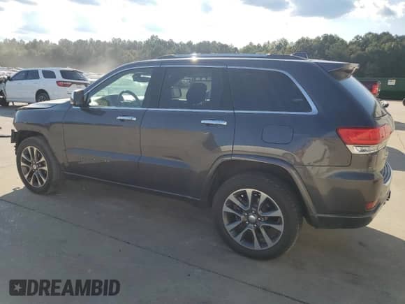 2017 Jeep Grand Cherokee Overland with VIN 1C4RJECGXHC916964, listed as a Copart auction lot 80358275 with 169,868 mi miles and Salvage title. Bid and sale history available at DreamBid. Image 2.