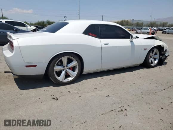 2012 Dodge Challenger SRT-8 392 с VIN 2C3CDYCJ6CH167309, выставлен на аукционе Copart как лот 64902735 с пробегом 124 180 миль миль и Списание • Salvage title. История ставок и продаж доступна на DreamBid. Изображение 3.