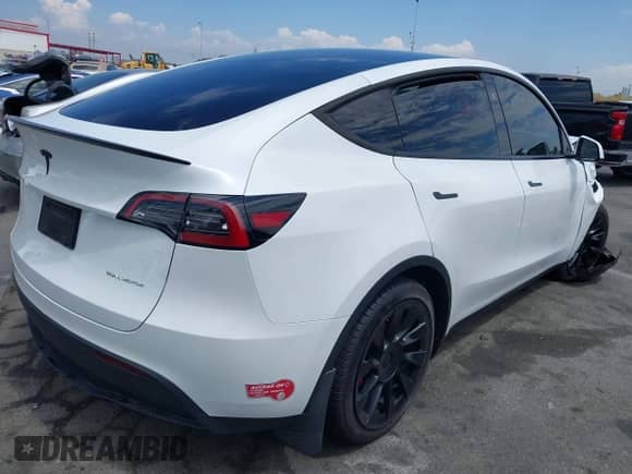 2023 Tesla Model Y Long Range with VIN 7SAYGDEE7PA124885, listed as a IAAI auction lot 43084065 with 22,983 mi miles and . Bid and sale history available at DreamBid. Image 4.