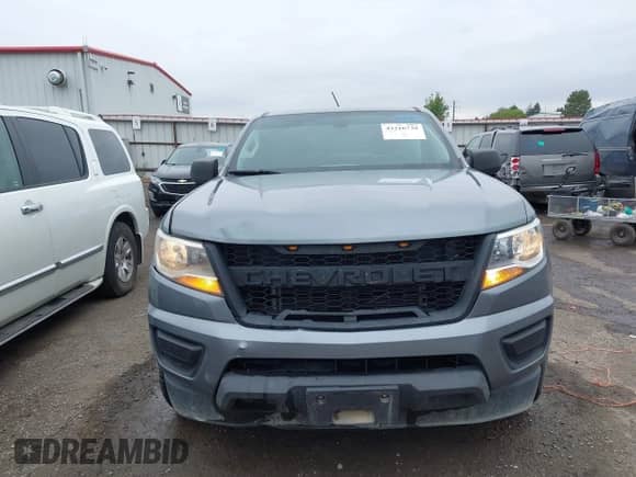2019 Chevrolet Colorado 2WD WT z VIN 1GCHSAEA2K1184892, wystawiony jako IAAI lot #43216739 z przebiegiem 50 266 mil mil oraz . Historia ofert i sprzedaży dostępna na DreamBid. Obrazek 13.