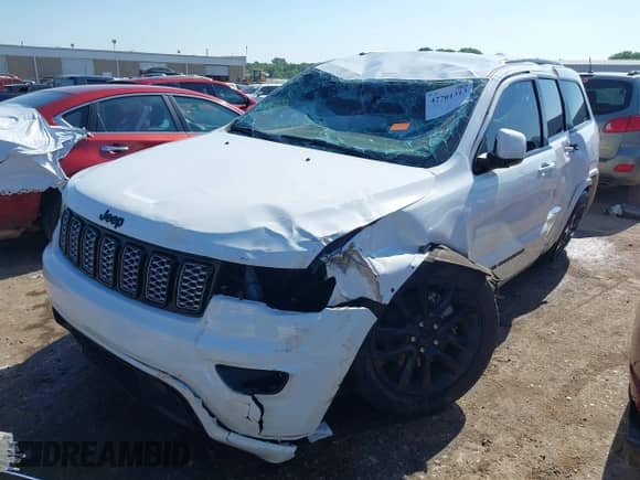 2021 Jeep Grand Cherokee Laredo X with VIN 1C4RJFAGXMC701636, listed as a IAAI auction lot 42701313 with 50,450 mi miles and . Bid and sale history available at DreamBid. Image 2.