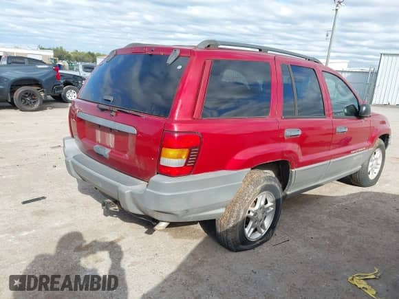 2002 Jeep Grand Cherokee Laredo with VIN 1J4GW48S22C174688, listed as a IAAI auction lot 43505430 with 215,268 mi miles and . Bid and sale history available at DreamBid. Image 4.