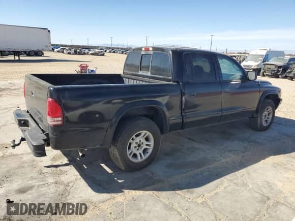 2003 Dodge Dakota Sport z VIN 1D7HL38N03S172331, wystawiony jako Copart lot #78851764 z przebiegiem 162 521 mil mil oraz Czysty tytuł • Clean title. Historia ofert i sprzedaży dostępna na DreamBid. Obrazek 3.