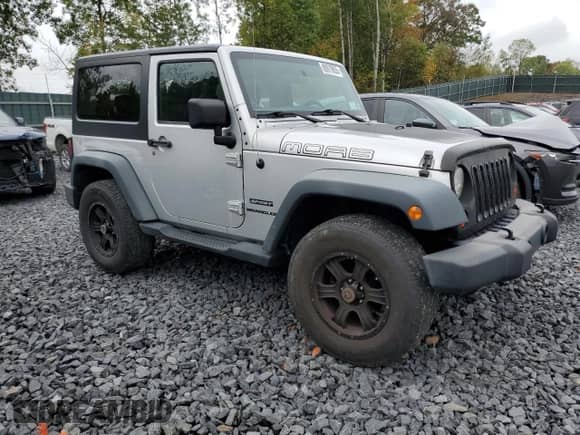 2012 Jeep Wrangler Sport z VIN 1C4AJWAG6CL228765, wystawiony jako Copart lot #80979855 z przebiegiem 216 434 mil mil oraz Szkoda całkowita • Salvage title. Historia ofert i sprzedaży dostępna na DreamBid. Obrazek 4.