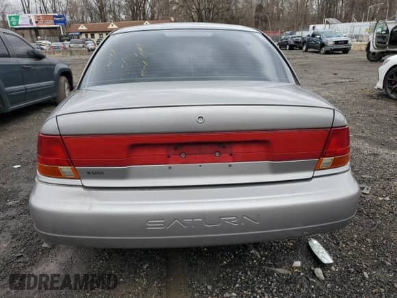 1999 Saturn SL with VIN 1G8ZK5271XZ174703, listed as a Copart auction lot 44570335 with 132,467 mi miles and Salvage title. Bid and sale history available at DreamBid. Image 6.