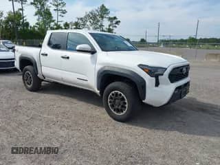 2024 Toyota Tacoma SR5 with VIN 3TYLB5JN1RT002580, listed as a IAAI auction lot 43249700 with 56,864 mi miles and . Bid and sale history available at DreamBid. Image 1.