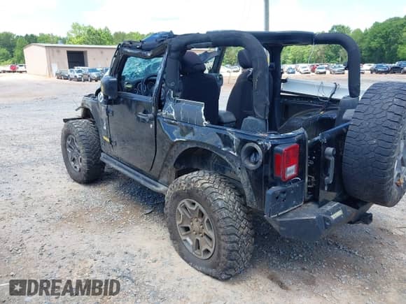 2013 Jeep Wrangler Rubicon 10th Anniversary with VIN 1C4BJWCG0DL573065, listed as a IAAI auction lot 42299018 with Not provided miles and . Bid and sale history available at DreamBid. Image 3.