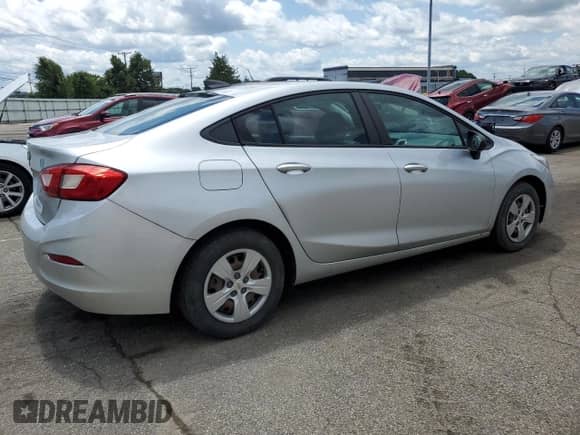 2018 Chevrolet Cruze LS с VIN 1G1BB5SM9J7211070, выставлен на аукционе Copart как лот 61216255 с пробегом 99 945 миль миль и Списание • Salvage title. История ставок и продаж доступна на DreamBid. Изображение 3.