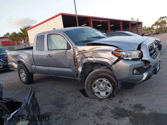 2018 Toyota Tacoma SR with VIN 5TFRX5GN8JX117075, listed as a IAAI auction lot 41723001 with 67,559 mi miles and . Bid and sale history available at DreamBid. Image 13.