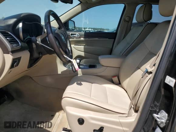 2015 Jeep Grand Cherokee High Altitude with VIN 1C4RJECGXFC906464, listed as a Copart auction lot 49657955 with 125,239 mi miles and Salvage title. Bid and sale history available at DreamBid. Image 7.
