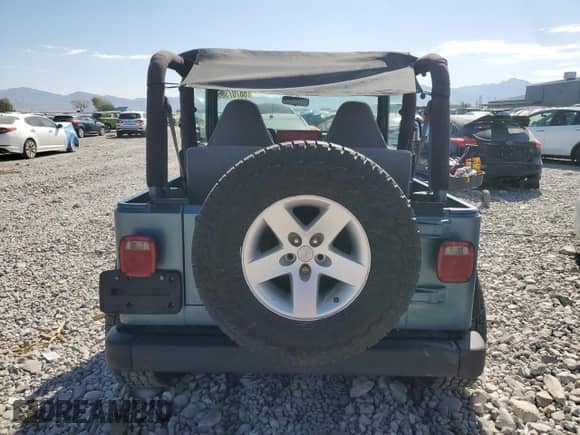 1998 Jeep Wrangler Sport z VIN 1J4FY19S5WP798597, wystawiony jako Copart lot #68707305 z przebiegiem Nie podano mil oraz Szkoda całkowita • Salvage title. Historia ofert i sprzedaży dostępna na DreamBid. Obrazek 6.