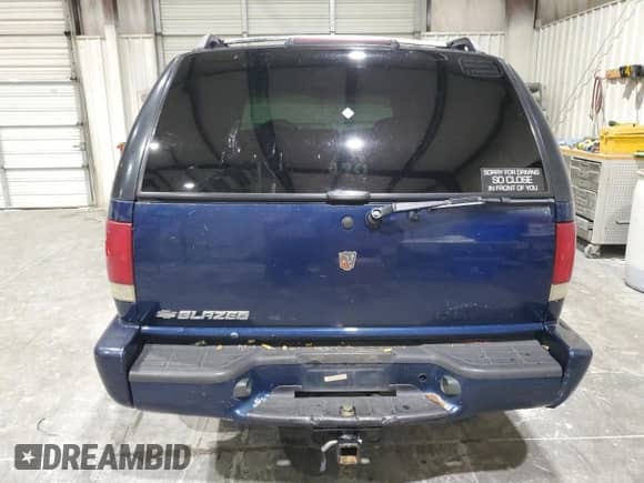 2000 Chevrolet Blazer LS z VIN 1GNCS13W7YK297644, wystawiony jako Copart lot #70089505 z przebiegiem 264 962 mil mil oraz Szkoda całkowita • Salvage title. Historia ofert i sprzedaży dostępna na DreamBid. Obrazek 6.