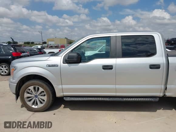 2018 Ford F-150 XL with VIN 1FTEW1CP2JFD42938, listed as a IAAI auction lot 42654180 with 119,099 mi miles and . Bid and sale history available at DreamBid. Image 14.
