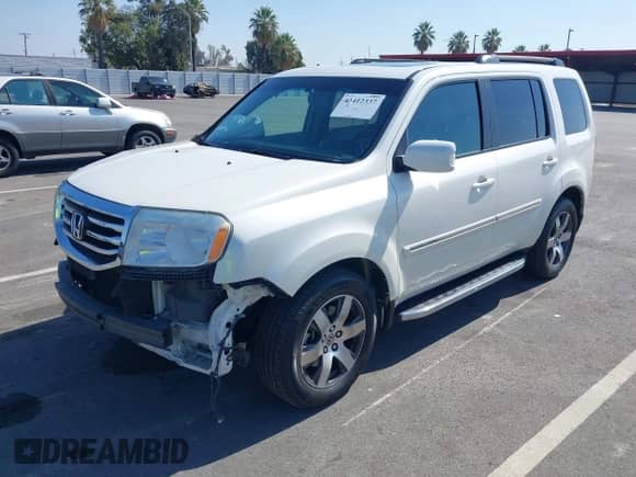 2013 Honda Pilot Touring with VIN 5FNYF4H90DB080130, listed as a IAAI auction lot 43412337 with 173,221 mi miles and . Bid and sale history available at DreamBid. Image 2.