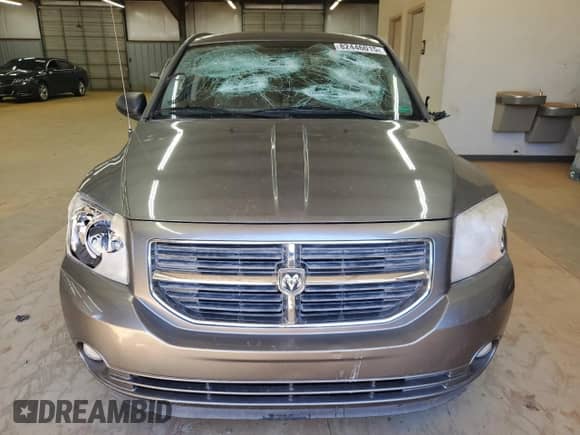 2011 Dodge Caliber Mainstreet with VIN 1B3CB3HAXBD261722, listed as a Copart auction lot 82446015 with 151,548 mi miles and Salvage title. Bid and sale history available at DreamBid. Image 5.