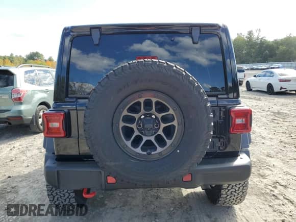 2023 Jeep Wrangler Rubicon z VIN 1C4HJXFN4PW636133, wystawiony jako Copart lot #75499614 z przebiegiem 13 252 mil mil oraz Szkoda całkowita • Salvage title. Historia ofert i sprzedaży dostępna na DreamBid. Obrazek 6.