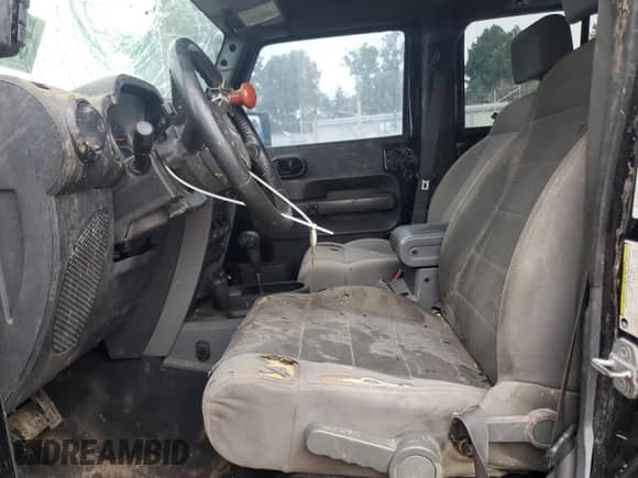 2007 Jeep Wrangler Unlimited Rubicon with VIN 1J4GA69117L112867, listed as a Copart auction lot 59909565 with 166,963 mi miles and Salvage title. Bid and sale history available at DreamBid. Image 7.