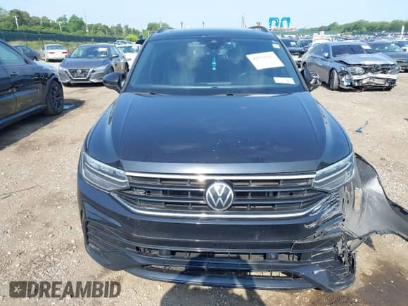 2022 Volkswagen Tiguan SE R-Line Black with VIN 3VV8B7AX6NM051090, listed as a IAAI auction lot 42522563 with 105,087 mi miles and . Bid and sale history available at DreamBid. Image 11.