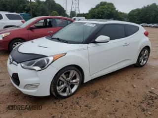 2013 Hyundai Veloster w/Black Int z VIN KMHTC6AD0DU149690, wystawiony jako Copart lot #68201775 z przebiegiem 112 030 mil mil oraz Szkoda całkowita • Salvage title. Historia ofert i sprzedaży dostępna na DreamBid. Obrazek 1.