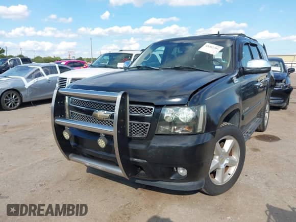 2007 Chevrolet Tahoe LT with VIN 1GNFC13J47R409143, listed as a IAAI auction lot 43302304 with 218,673 mi miles and . Bid and sale history available at DreamBid. Image 2.