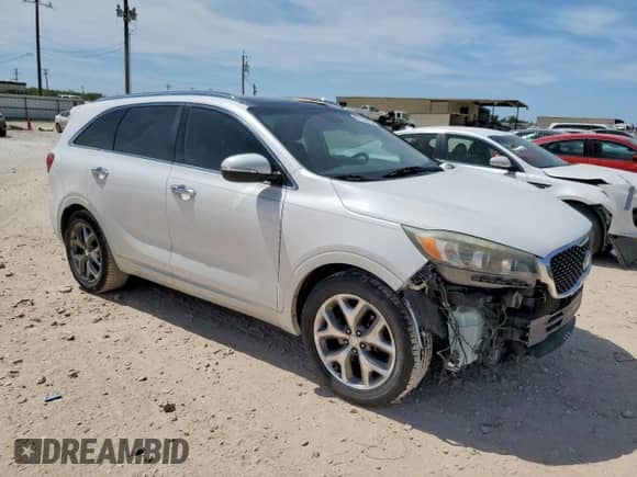 2016 Kia Sorento SXL с VIN 5XYPK4A58GG074670, выставлен на аукционе Copart как лот 66736465 с пробегом 143 911 миль миль и Списание • Salvage title. История ставок и продаж доступна на DreamBid. Изображение 4.