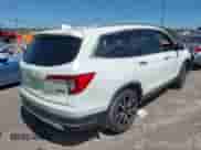 2020 Honda Pilot Touring 7-Passenger z VIN 5FNYF5H69LB000835, wystawiony jako IAAI lot #42318516 z przebiegiem 122 572 mil mil oraz . Historia ofert i sprzedaży dostępna na DreamBid. Obrazek 4.