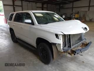 2020 Chevrolet Tahoe Commercial z VIN 1GNLCDECXLR154849, wystawiony jako IAAI lot #42050778 z przebiegiem 124 771 mil mil oraz . Historia ofert i sprzedaży dostępna na DreamBid. Obrazek 1.