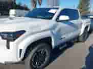 2024 Toyota Tacoma SR5 with VIN 3TMLB5JN8RM034034, listed as a IAAI auction lot 41253779 with 21,448 mi miles and . Bid and sale history available at DreamBid. Image 6.