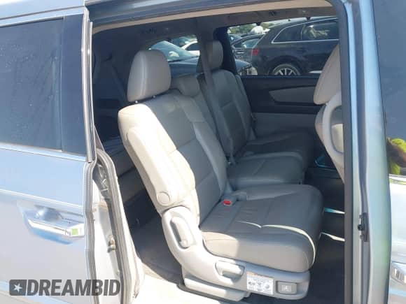 2012 Honda Odyssey Touring with VIN 5FNRL5H97CB130670, listed as a IAAI auction lot 43438076 with 198,047 mi miles and . Bid and sale history available at DreamBid. Image 8.