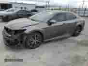 2023 Toyota Camry Hybrid SE with VIN 4T1S31AKXPU055821, listed as a Copart auction lot 84012145 with 148,408 mi miles and Salvage title. Bid and sale history available at DreamBid. Image 1.